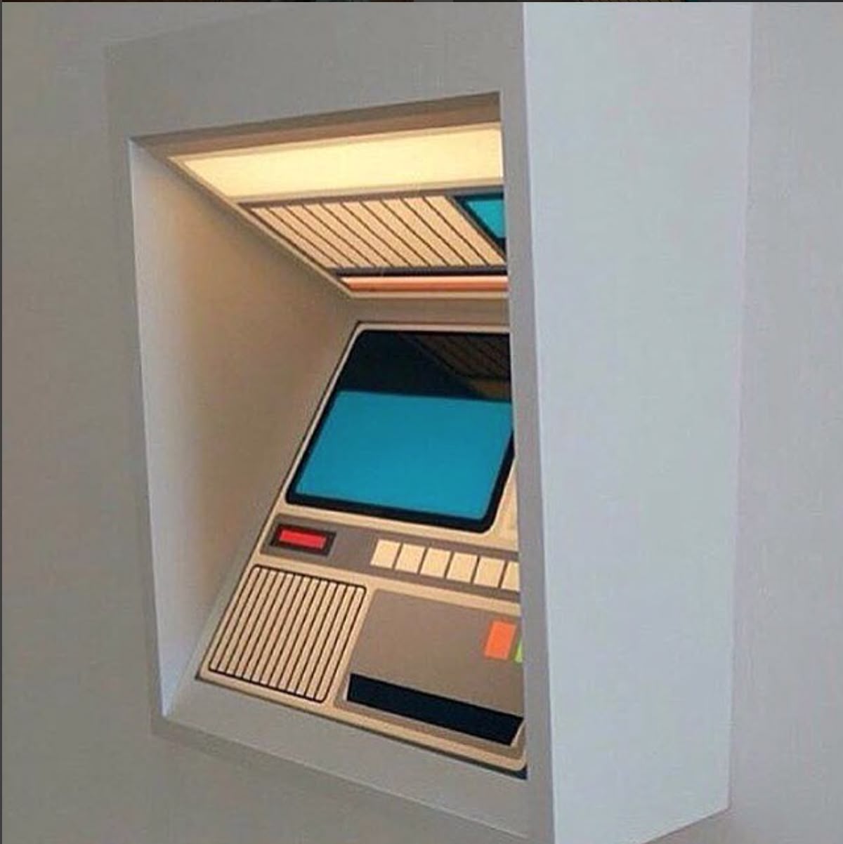Wall-mounted terminal kiosk with a teal CRT screen